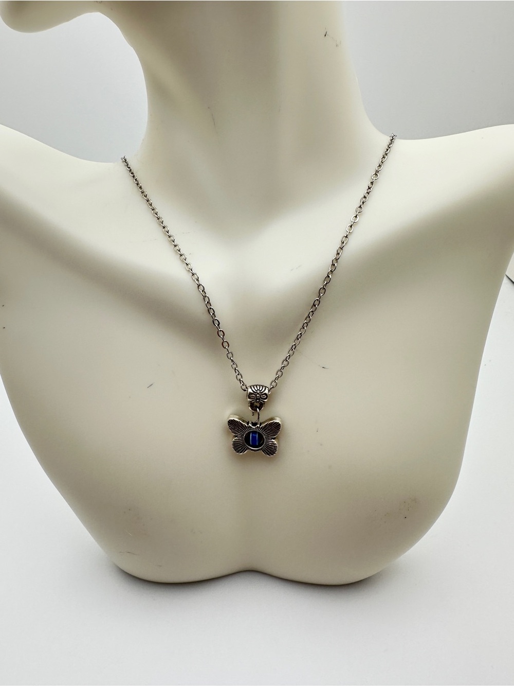 Silver Butterfly Pendant Necklace with Blue Stone